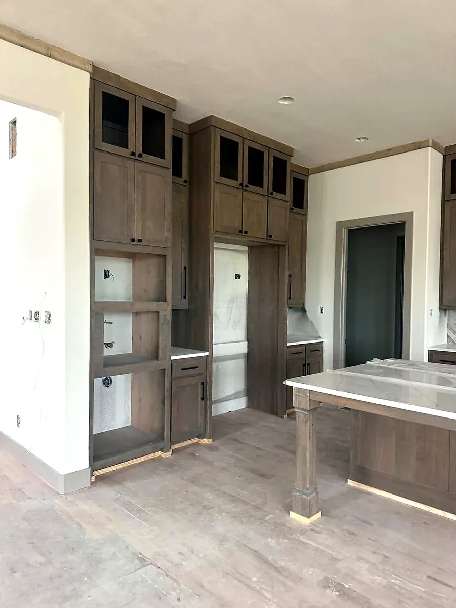 Teddy crew building custom built in cabinets and trim, work in progress